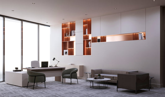 Modern executive office with full-height windows, designer desk, and elegant seating area including sofa, lounge chairs, and coffee tables. Built-in illuminated shelves with warm lighting and decorative accessories enhance the luxurious workspace ambiance. Premium corporate fit-out for professional interiors. Best interior fit-out in Riyadh by Atelier 21 KSA – افضل شركة تشطيبات داخلية للمكاتب والشركات في السعودية. 16