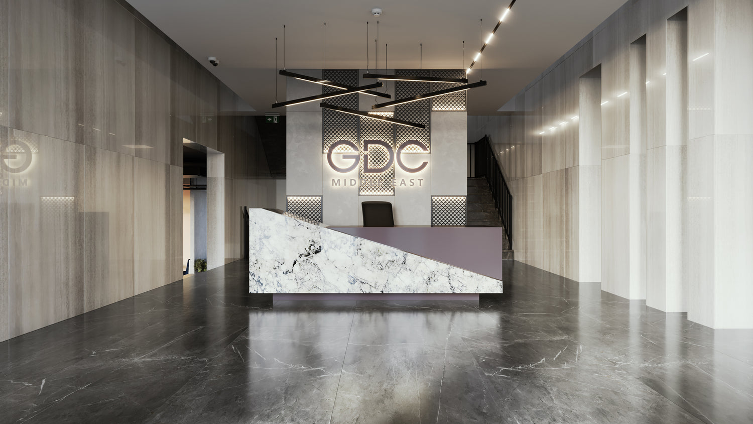 Reception area of GDC Middle East designed by Atelier 21 KSA, featuring a bold marble reception desk, modern lighting, and sleek finishes – exemplifying the expertise of a Top Interior Designer and Top Office Furniture Supplier in Saudi Arabia and Riyadh. منطقة الاستقبال في GDC ميدل إيست من تنفيذ مفن الرسام، تضم مكتب استقبال من الرخام وإضاءة عصرية وتشطيبات راقية، مما يعكس احترافية مفن الرسام كأفضل مصمم داخلي ومورد أثاث ومصمم مكاتب في السعودية والرياض.