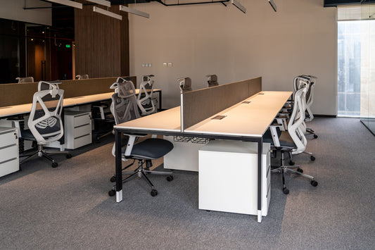 Modern open-plan workstation at Azm Saudi Project, featuring ergonomic office chairs, sleek desks, and collaborative workspace design. Executed by a Top Office Designer in Riyadh and supplied by a Top Office Furniture Supplier in Saudi Arabia, this setup enhances productivity and comfort. مساحة عمل عصرية في مشروع عزم السعودية من تصميم أفضل مصمم مكاتب في السعودية وتشطيب من أفضل شركة تنفيذ تشطيبات داخلية في الرياض. 2