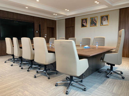 Elegant boardroom with executive chairs, large wooden meeting table, and integrated technology at The Saudi Irrigation Organization – designed by Atelier 21 KSA, Top Interior Designer, Office Designer, Furniture Supplier, and Interior Fit-out Company in Saudi Arabia and Riyadh. غرفة اجتماعات تنفيذية أنيقة مع طاولة كبيرة وكراسي مريحة من تنفيذ مفن الرسام، أفضل مصمم داخلي، ومصمم مكاتب، ومورد أثاث، وشركة تشطيب داخلي في السعودية والرياض. 7