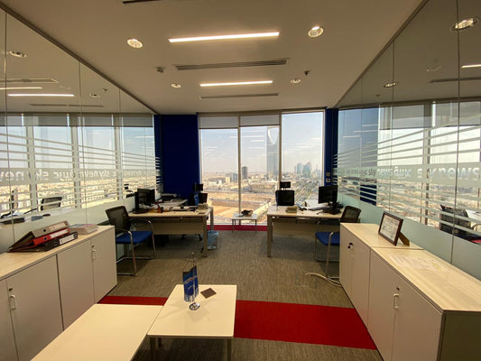Sky News Arabia Riyadh office by Atelier 21 KSA | مفن الرسام, offering a panoramic view of Riyadh. Executed by أفضل شركة تنفيذ تشطيبات داخلية في السعودية and furnished by Top Office Furniture Supplier in Riyadh. This workspace features modern desks and storage units, showcasing our commitment as أفضل مصمم داخلي في السعودية and أفضل مصمم مكاتب في الرياض. A leading example of top interior fit-out and التصميم الداخلي العصري للمكاتب. 10